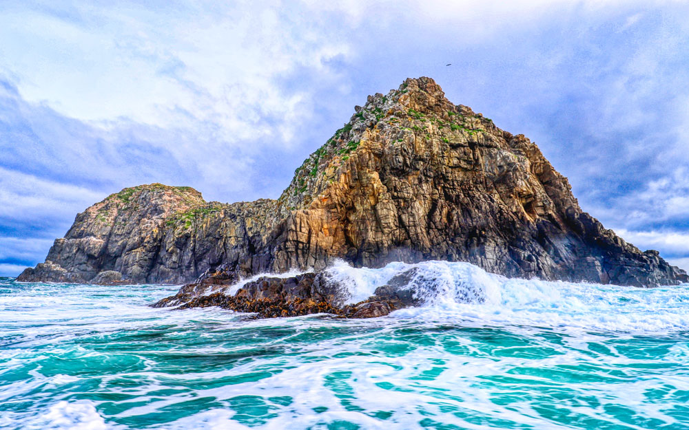 Ocean with island rock in the background