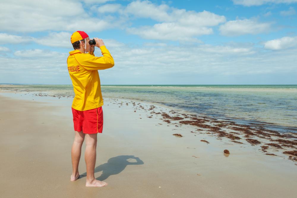 Photograph of a life saver watching the ocean