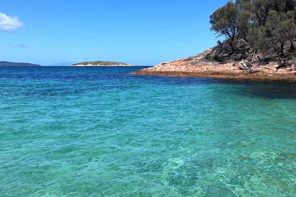 ocean with the rocky shore to the right